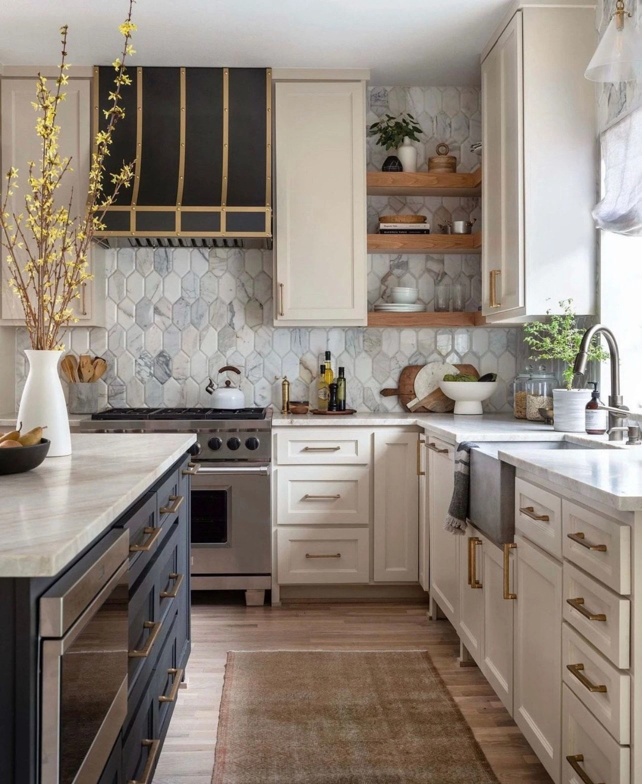 black custom kitchen range hood with brass banding stainless metalwork