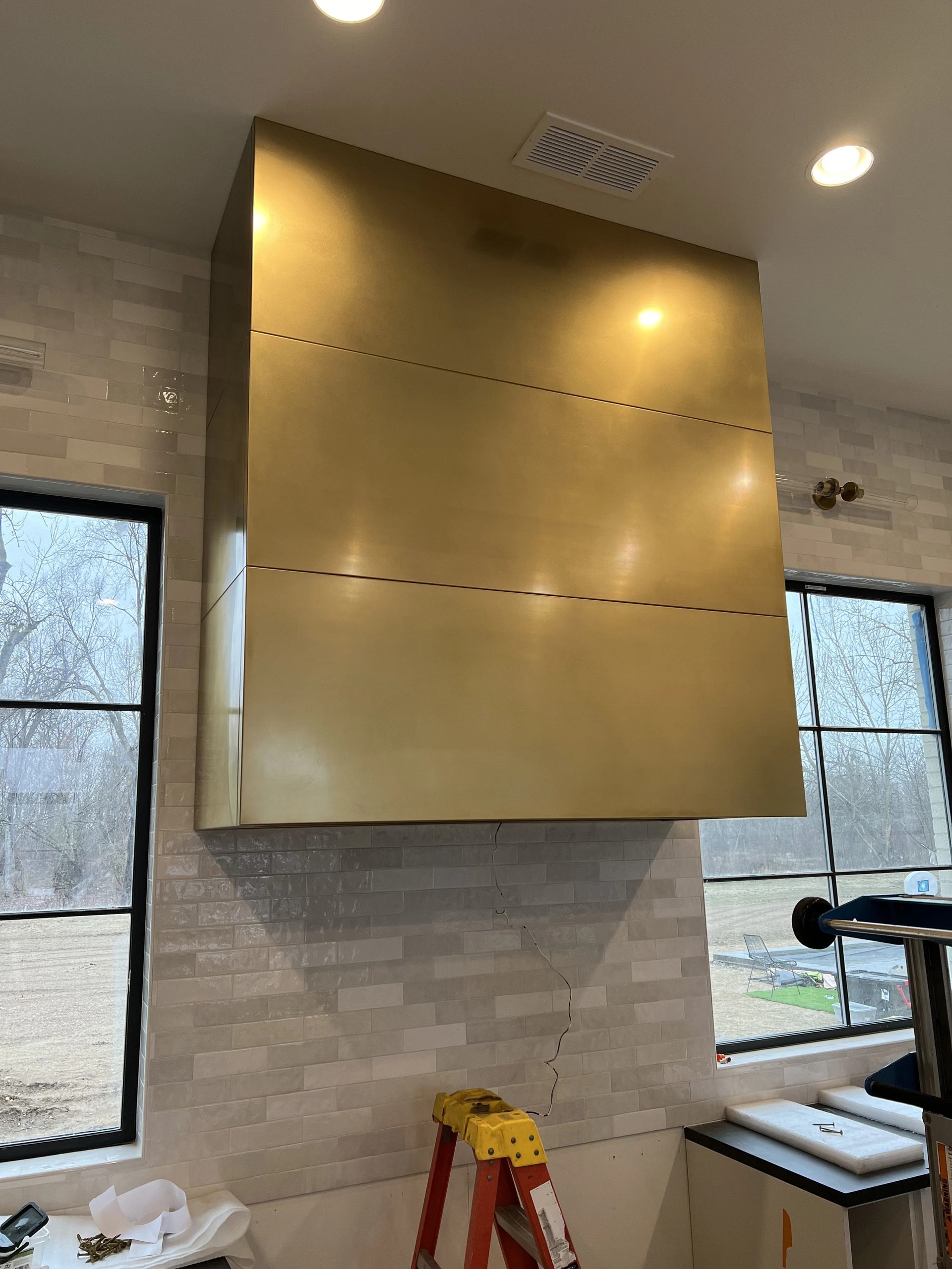 brushed gold sheet metal kitchen range hood custom fabrication install