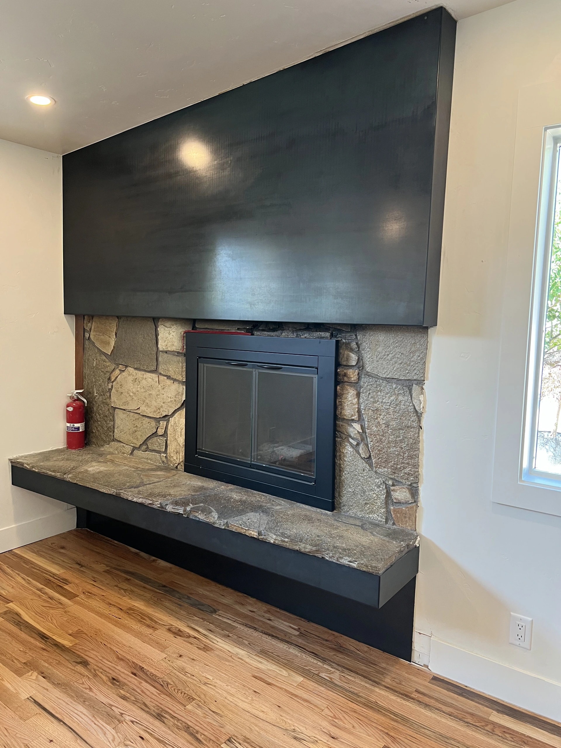 custom black sheet metal fireplace surround with steel hearth trim