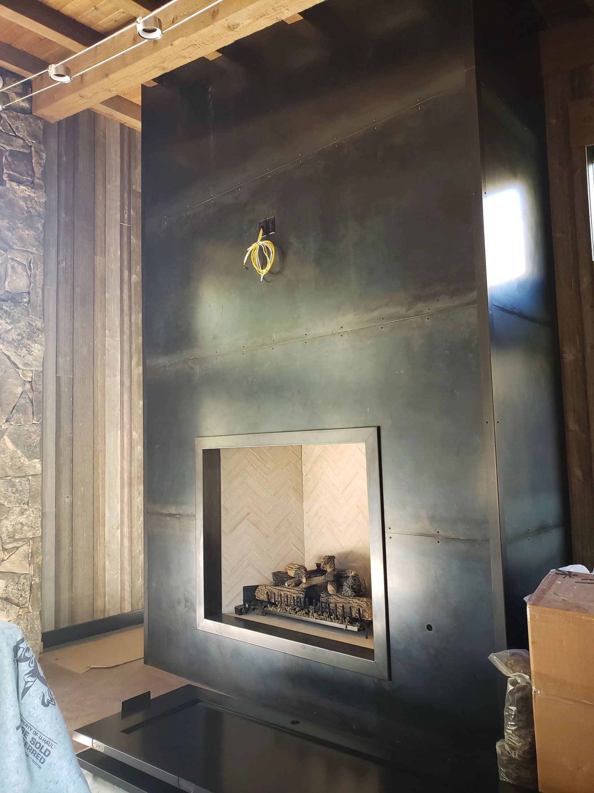 custom blackened sheet metal fireplace surround industrial steel panels