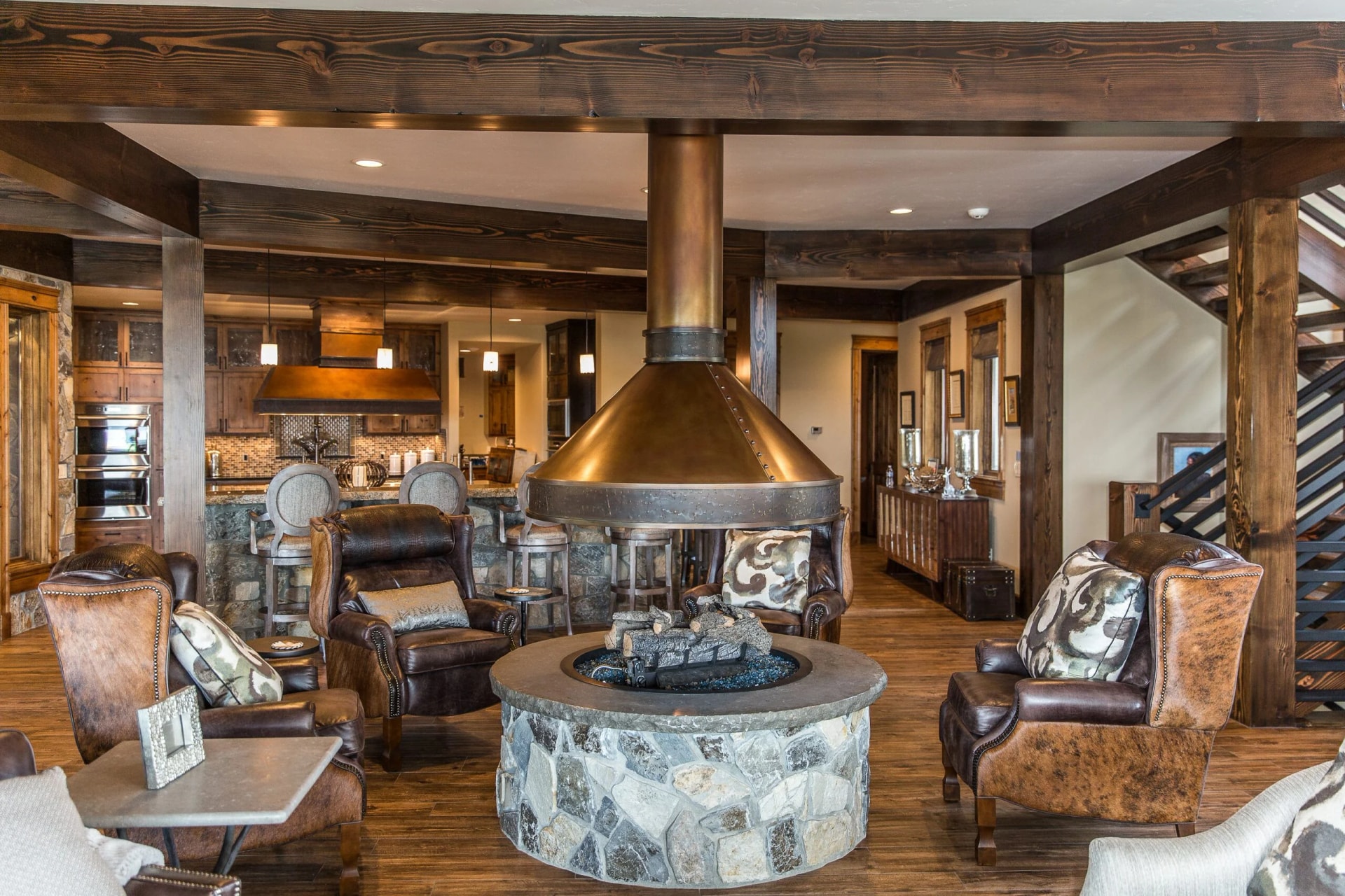 custom copper fireplace hood over stone fire pit