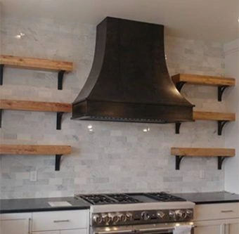 dark custom metal kitchen range hood with steel shelf brackets