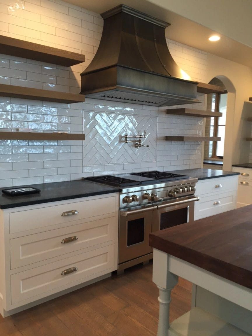 dark riveted custom kitchen range hood sheet metal fabrication
