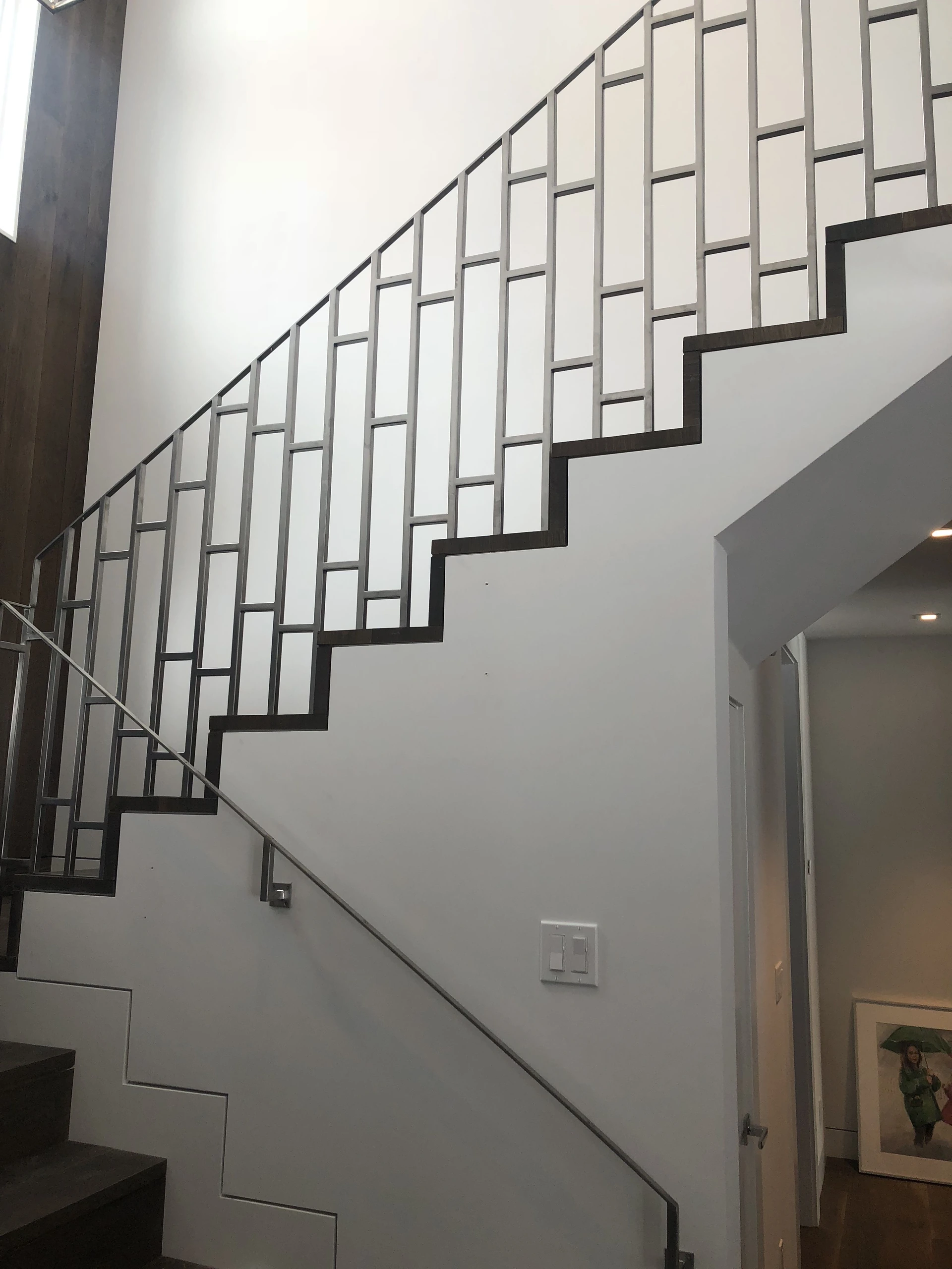 geometric ornamental metal stair railing modern stainless fabrication