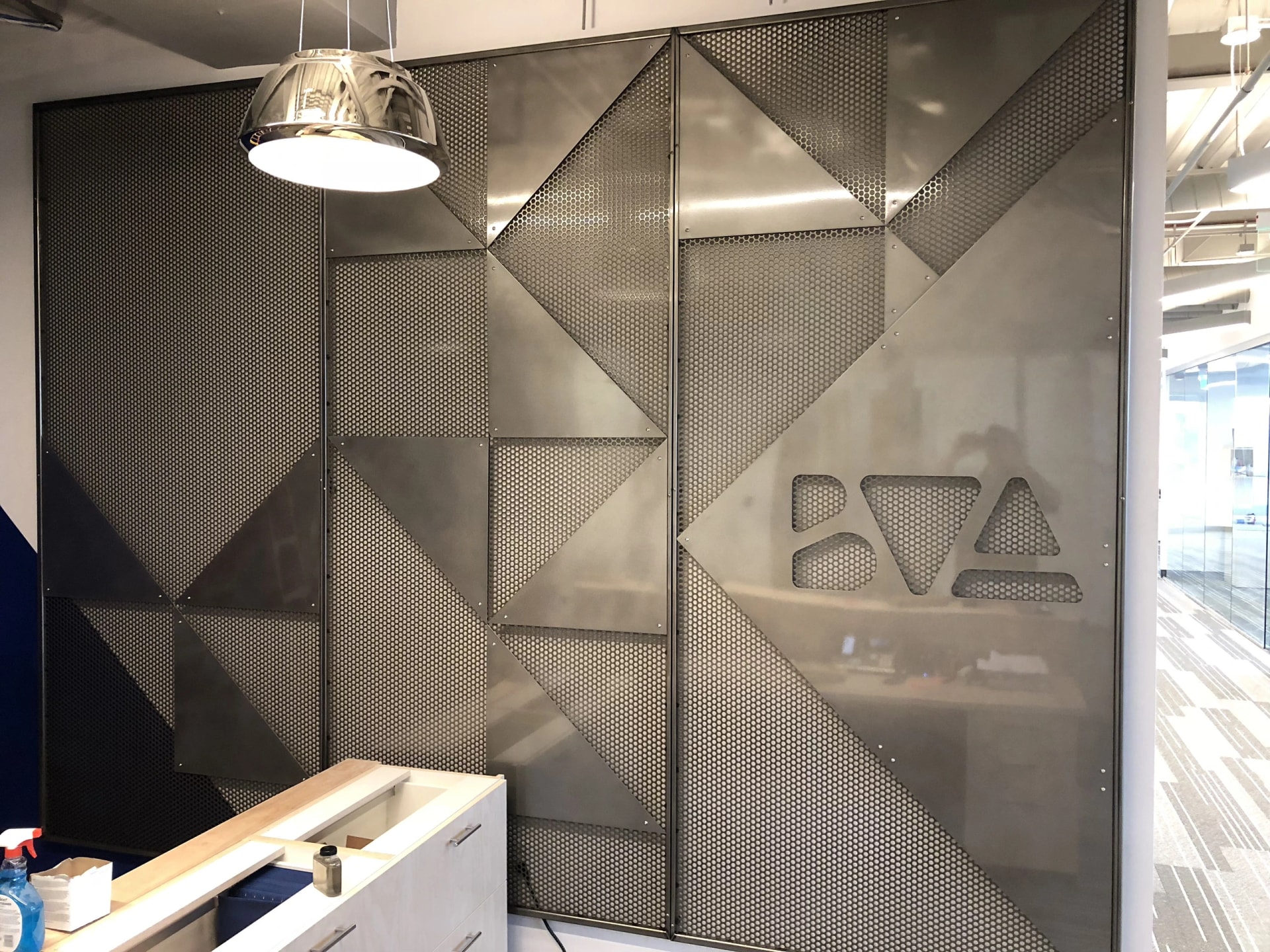 geometric perforated sheet metal wall partition laser cut logo fabrication