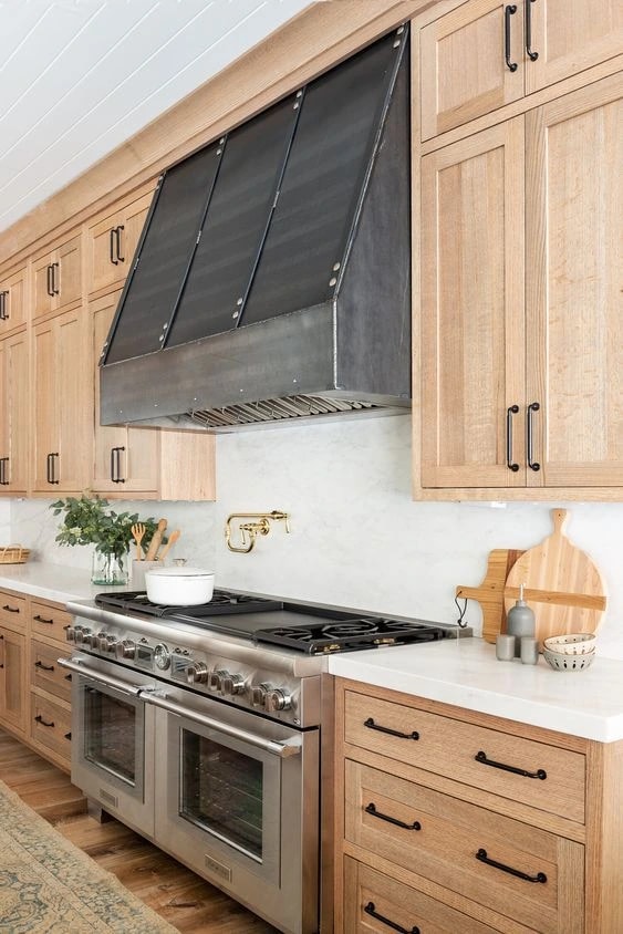 industrial blackened steel kitchen range hood riveted straps custom fabrication