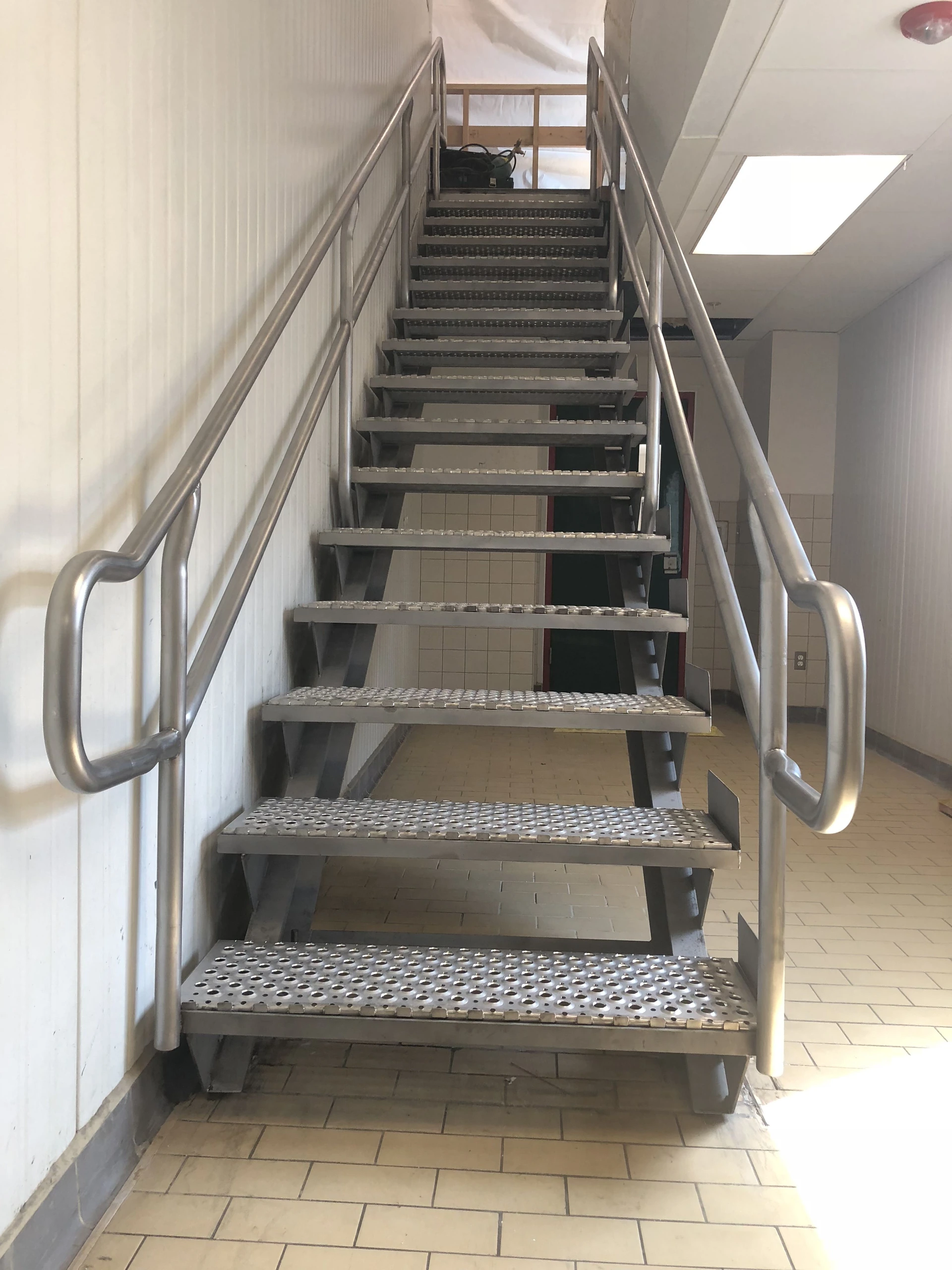 stainless industrial staircase perforated treads tubular handrail welding